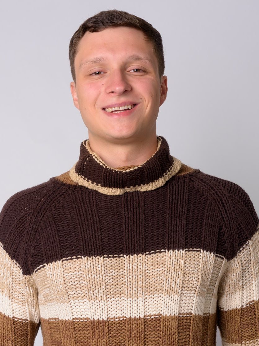portrait-of-happy-young-man-with-turtleneck-sweater-smiling-e1624349937529.jpg